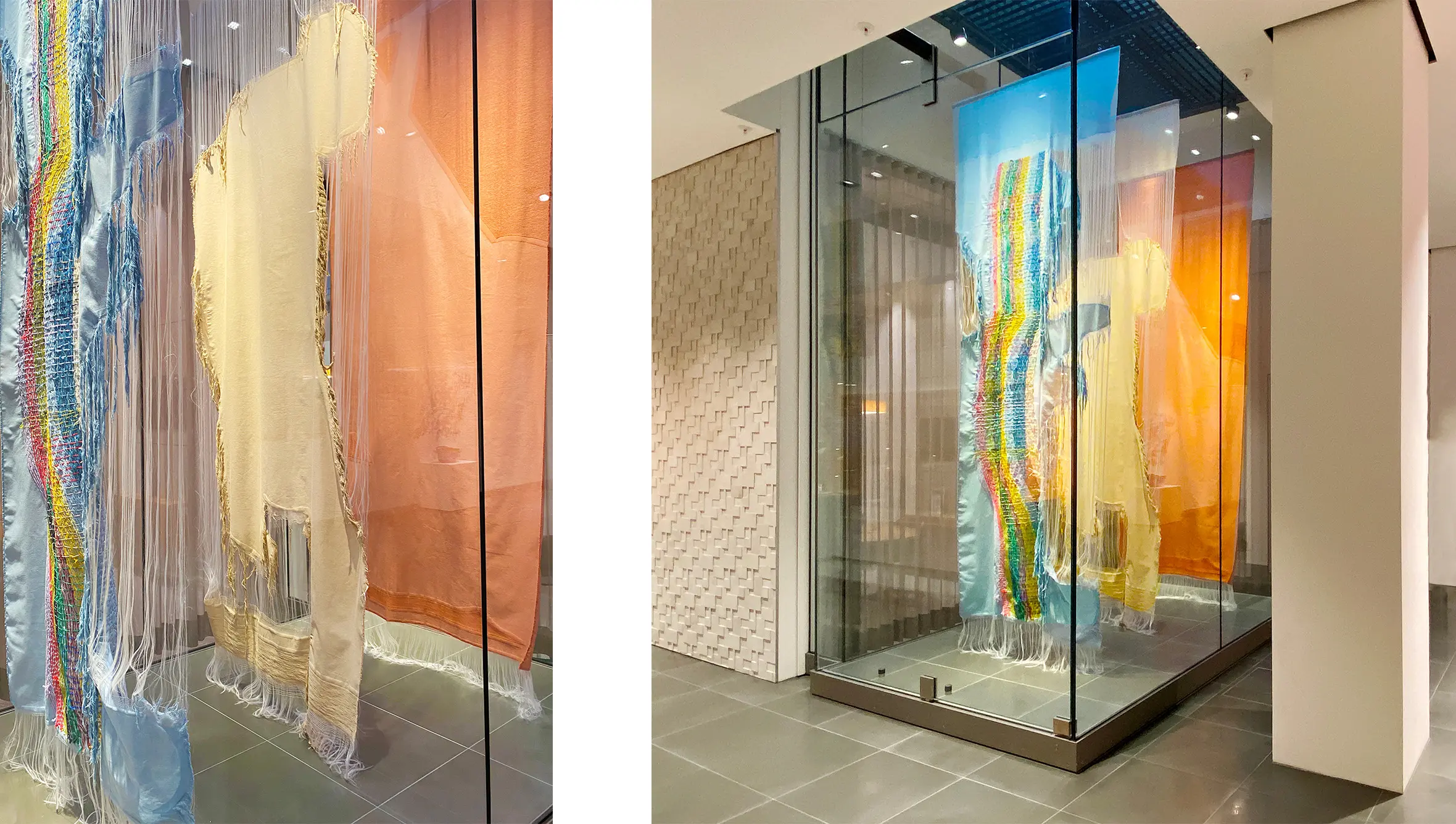 Installation mit drei unterschiedlichen Stoffbahnen im HVB KunstCUBE in München umgeben von Glaswänden
