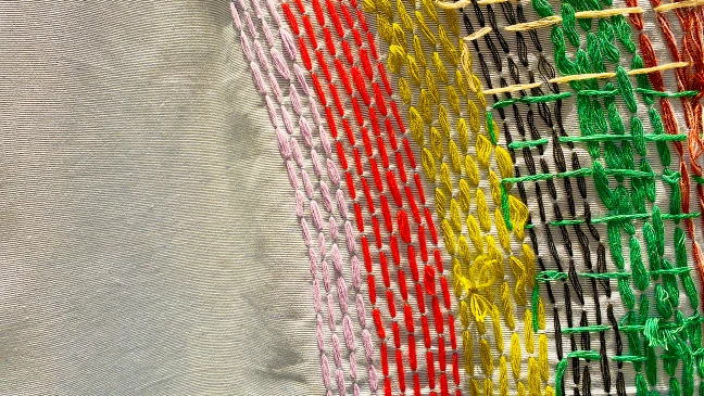 Detail von gewebten Stoff mit bunten Fänden